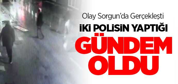 Sorgun'da sivil polis memurları düşen bayrağı yerden alması güvenlik kameralarına yansıdı